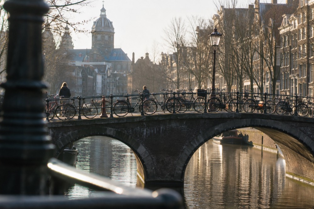 Bicycles parked on a canal bridge in central Amsterdam