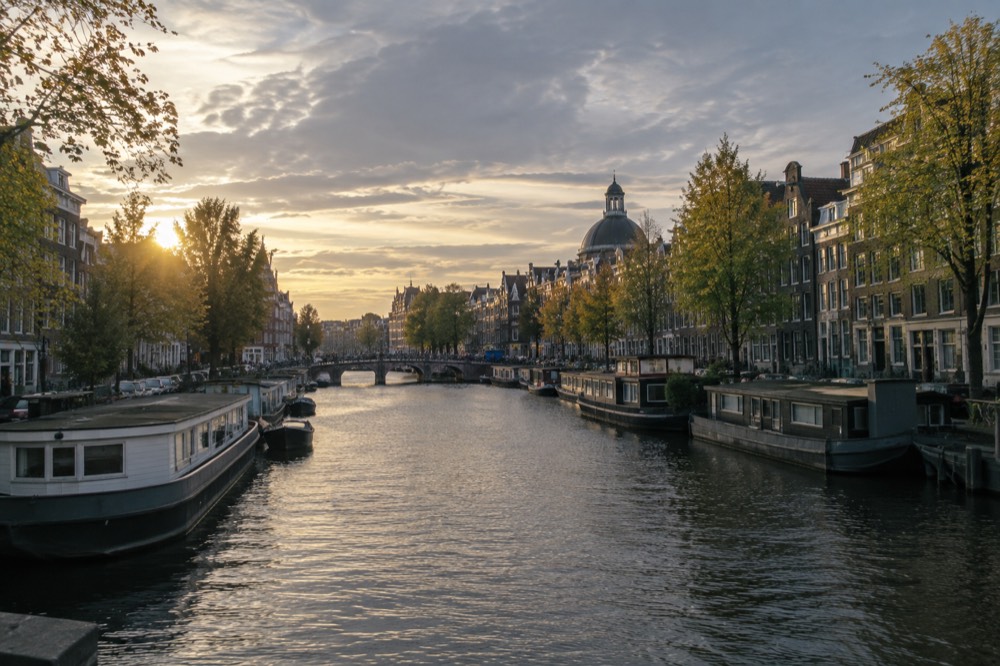 Evening light on a canal with moored houseboats