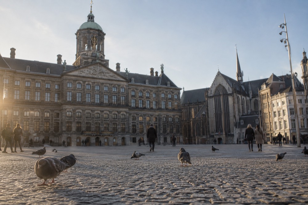 A street-level view of Dam Square on an ordinary weekday morning