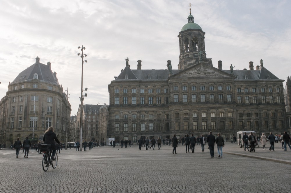 The approach to Dam Square, with bicycles leaning against the railings