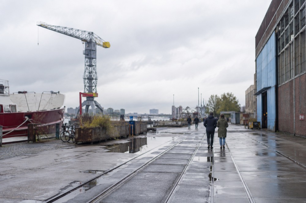The waterfront near NDSM Wharf under a broad grey northern sky