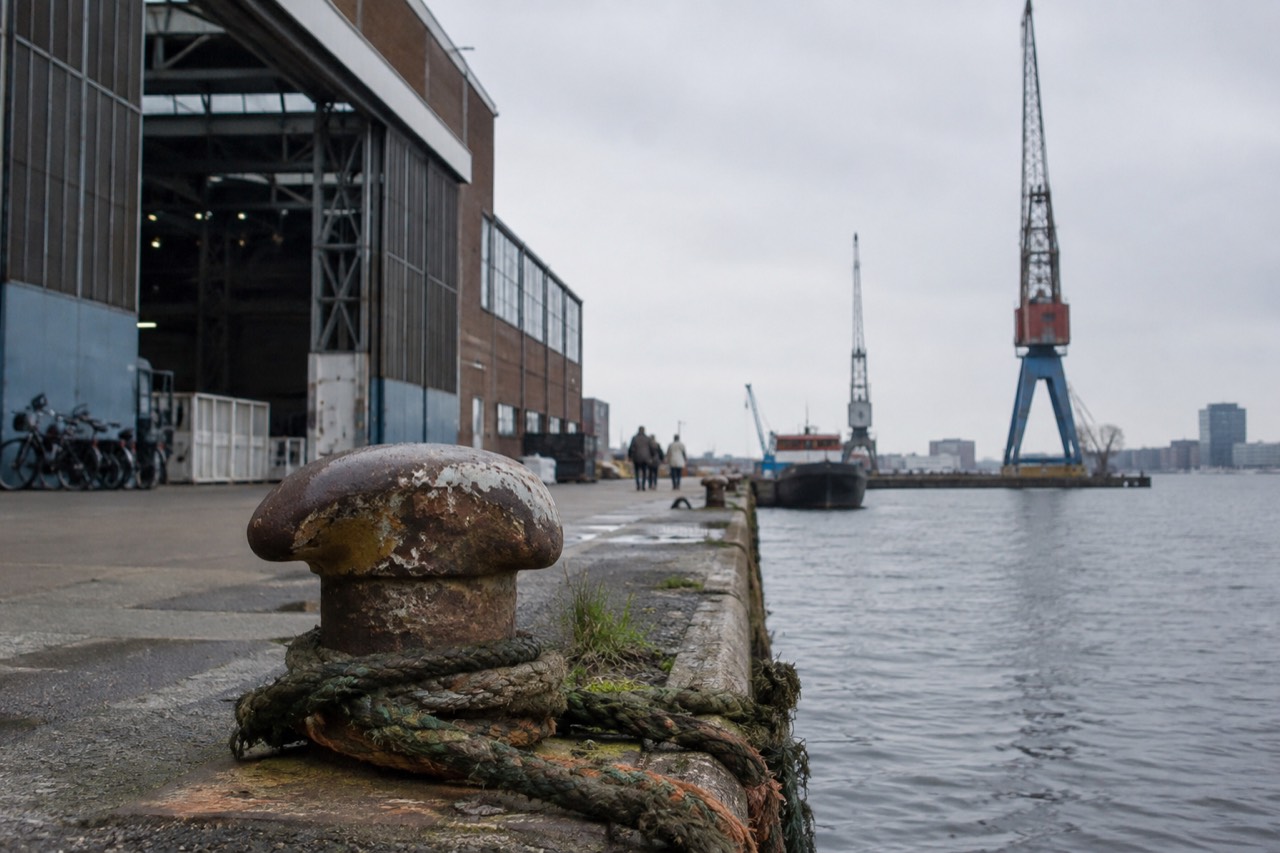 Former shipyard warehouses along the water at NDSM Wharf in Amsterdam Noord