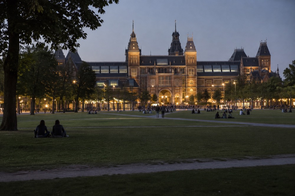 Museumplein lawn with the Rijksmuseum building behind it under a clear sky
