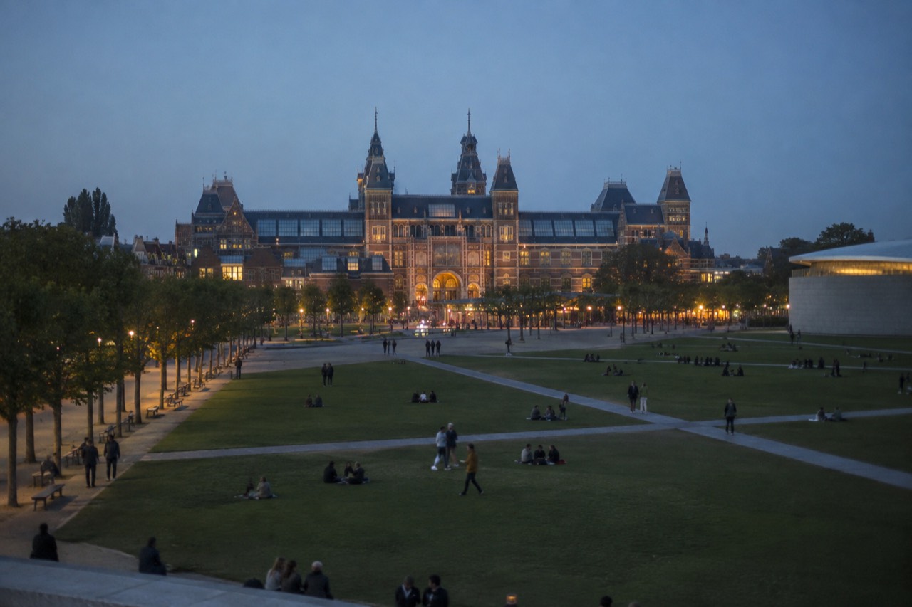 Museumplein lawn with the Rijksmuseum building behind it under a clear sky