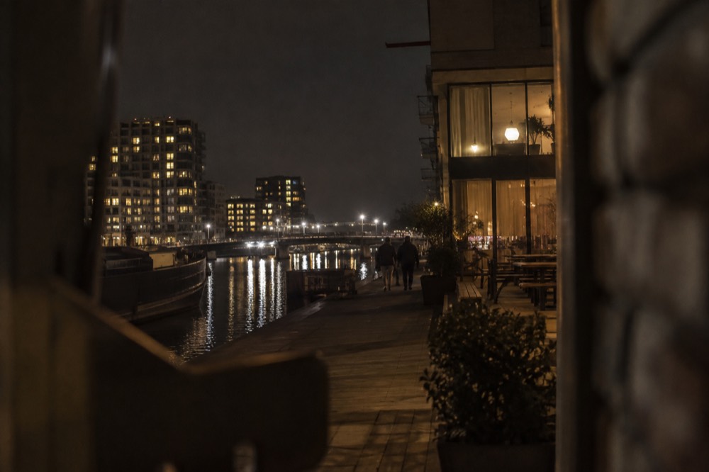 Brick facades and a quiet canal edge beside Eastern Docklands