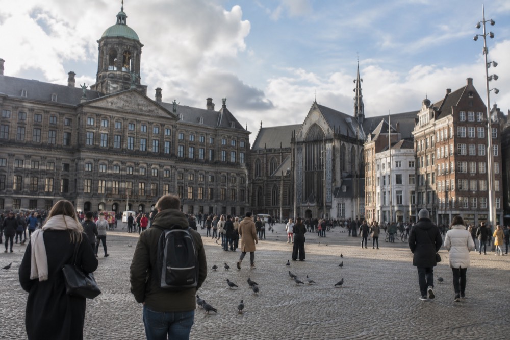 A street-level view of Dam Square on an ordinary weekday morning