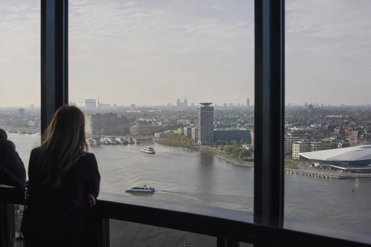View from the A'DAM Lookout observation deck over Amsterdam's skyline and IJ river