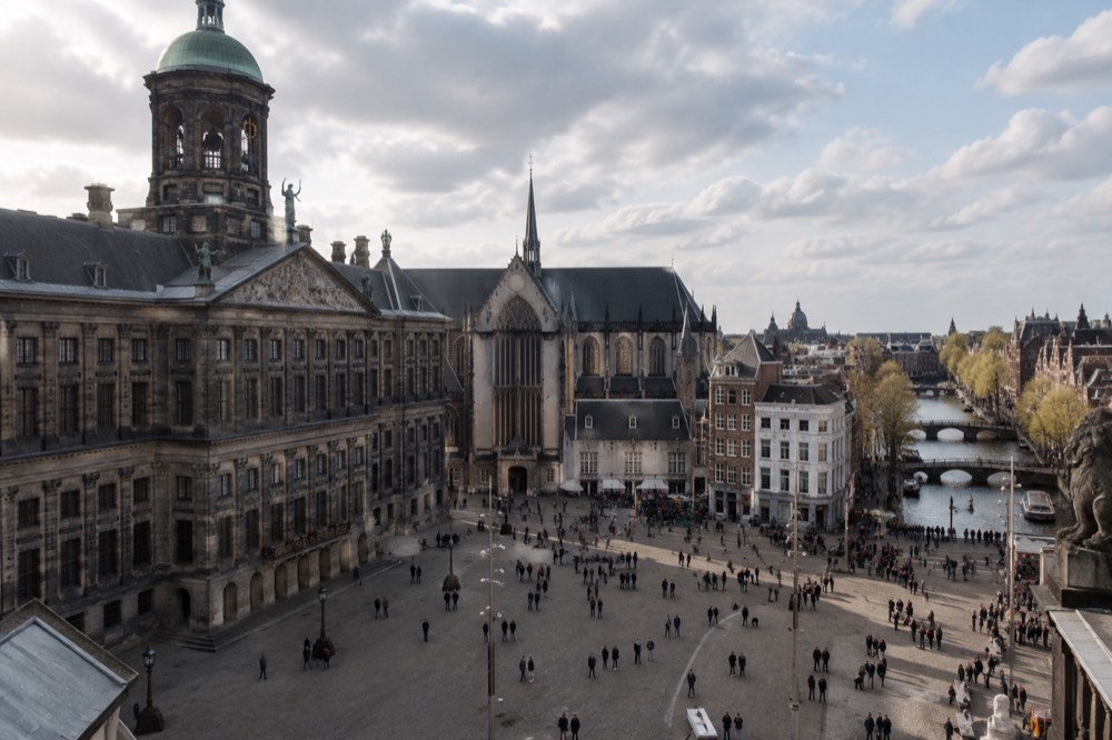 The approach to Dam Square, with bicycles leaning against the railings
