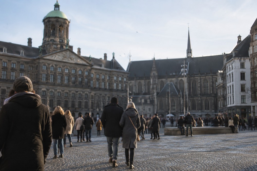 Low winter sun across the rooftops near Dam Square