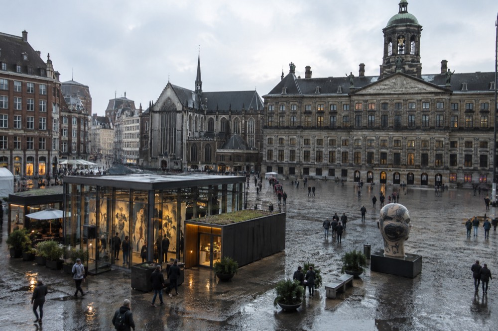 The approach to Dam Square, with bicycles leaning against the railings