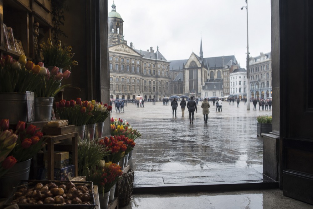 A street-level view of Dam Square on an ordinary weekday morning