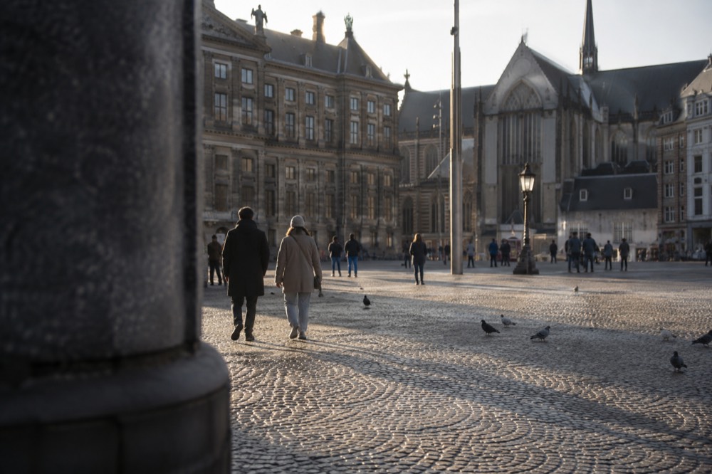 A canal bridge and moored boats close to Dam Square