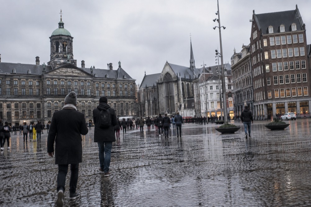 The approach to Dam Square, with bicycles leaning against the railings