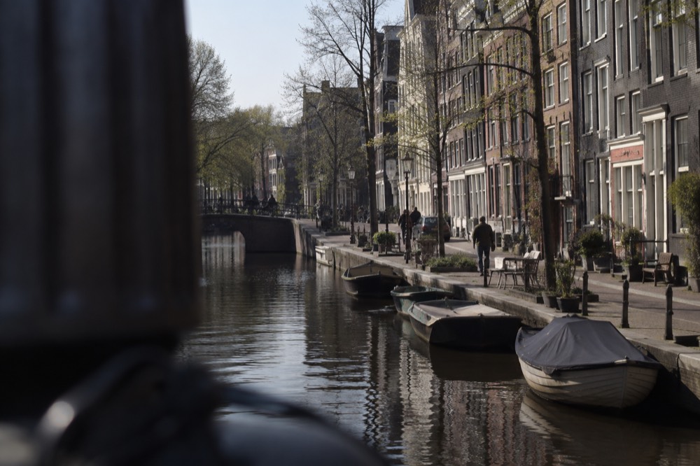 Wide daylight exhibition gallery inside a historic Amsterdam museum building