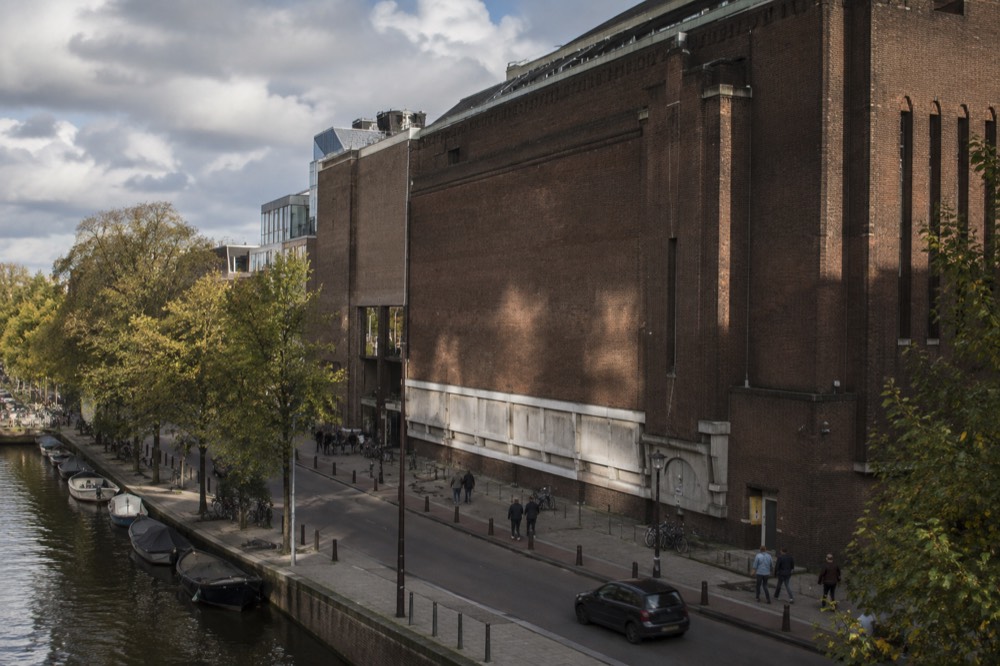 The historic brick facade of the former Heineken brewery building in Amsterdam