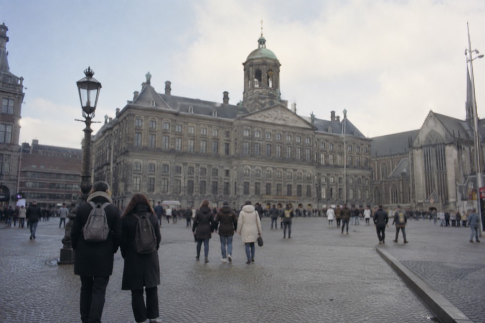 The approach to Dam Square, with bicycles leaning against the railings