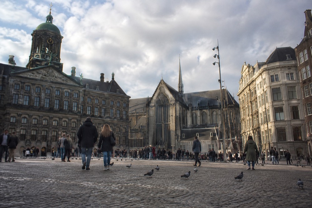 A canal bridge and moored boats close to Dam Square