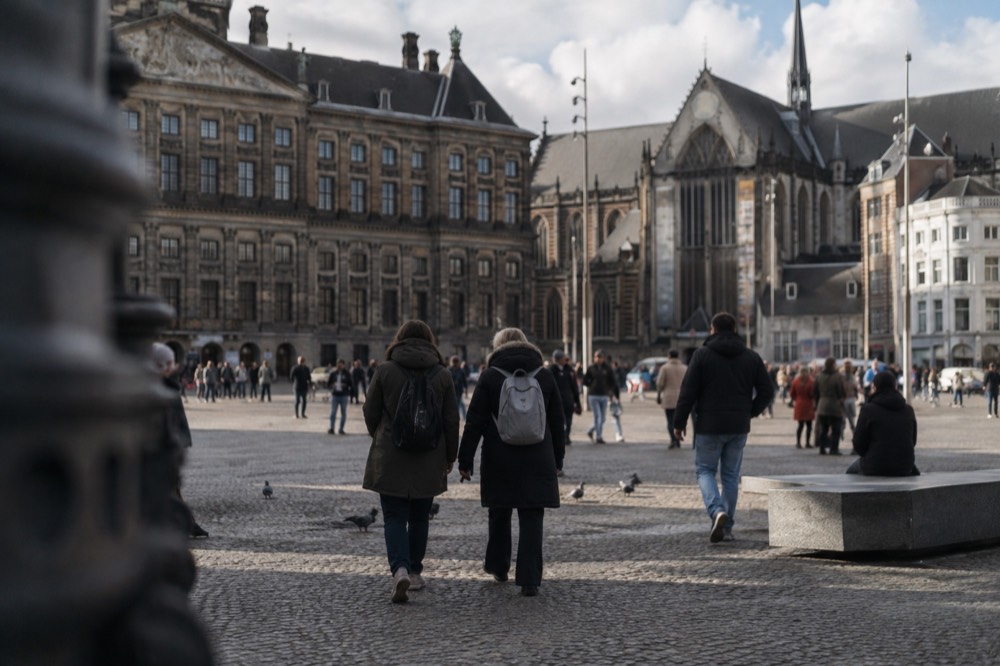 A street-level view of Dam Square on an ordinary weekday morning