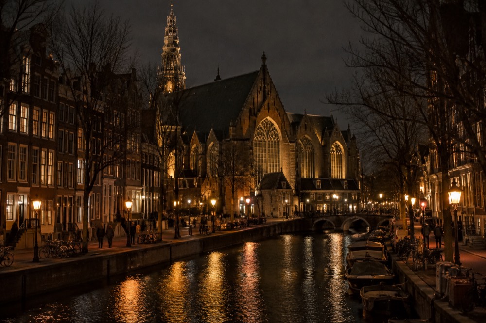 Low winter sun across the rooftops near Oude Kerk