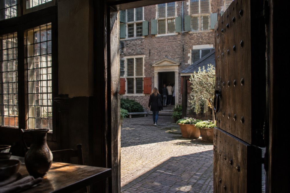 Brick facades and a quiet canal edge beside Rembrandt House