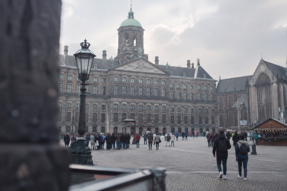 The approach to Dam Square, with bicycles leaning against the railings
