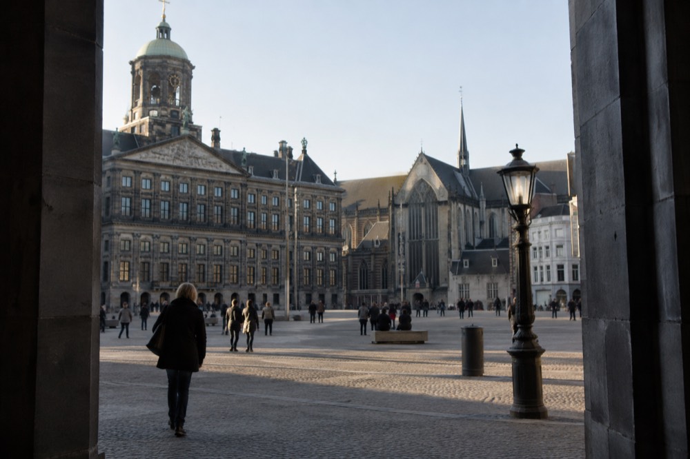 A canal bridge and moored boats close to Dam Square