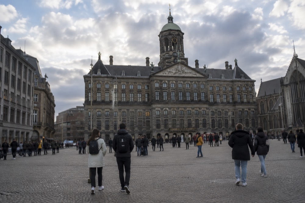 A canal bridge and moored boats close to Dam Square