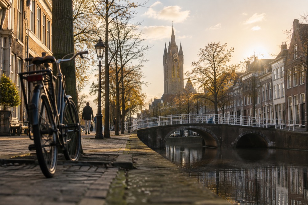 A canal bridge and moored boats close to Delft