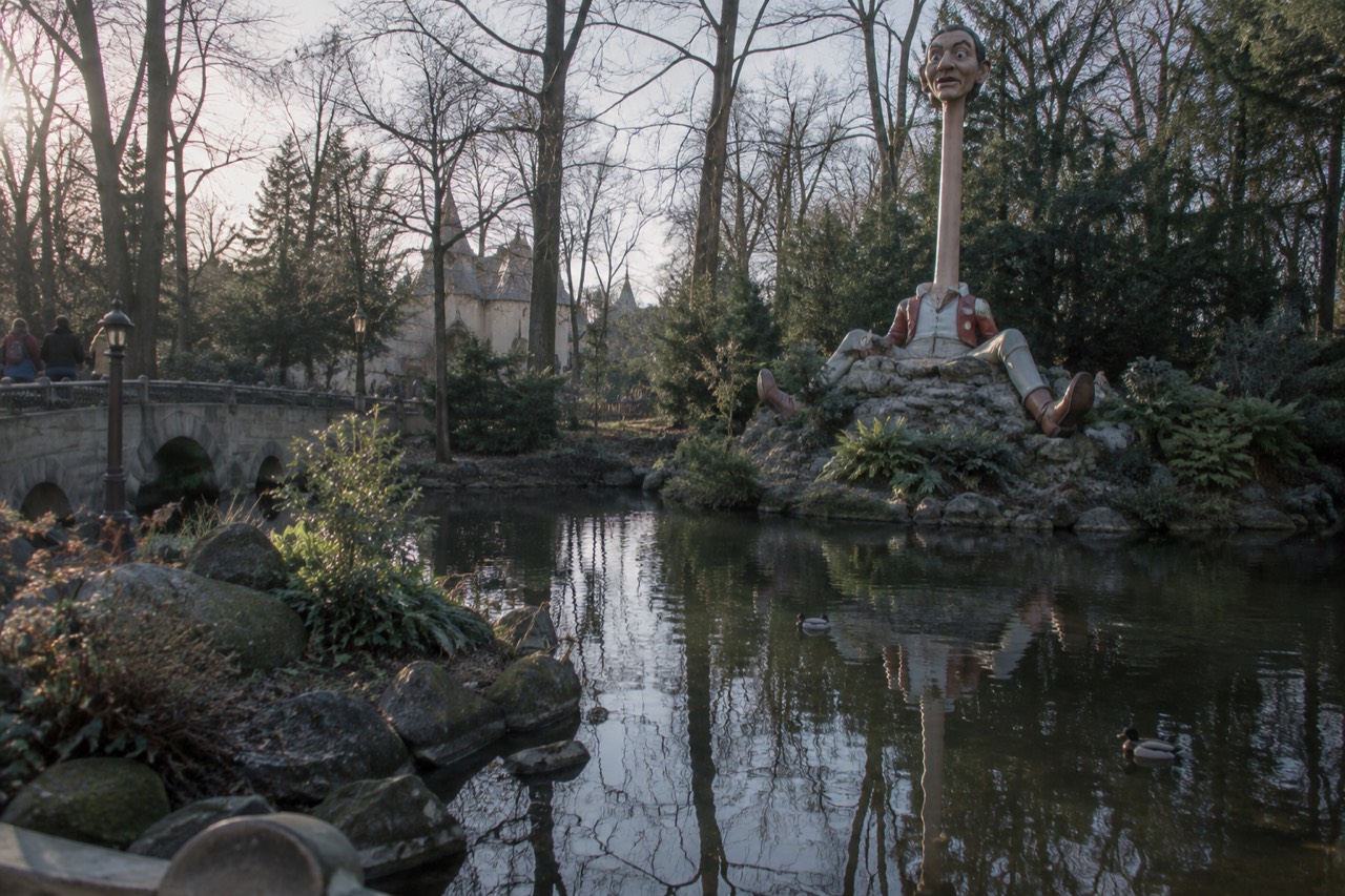 Efteling fairytale forest with iconic Langnek character and pond