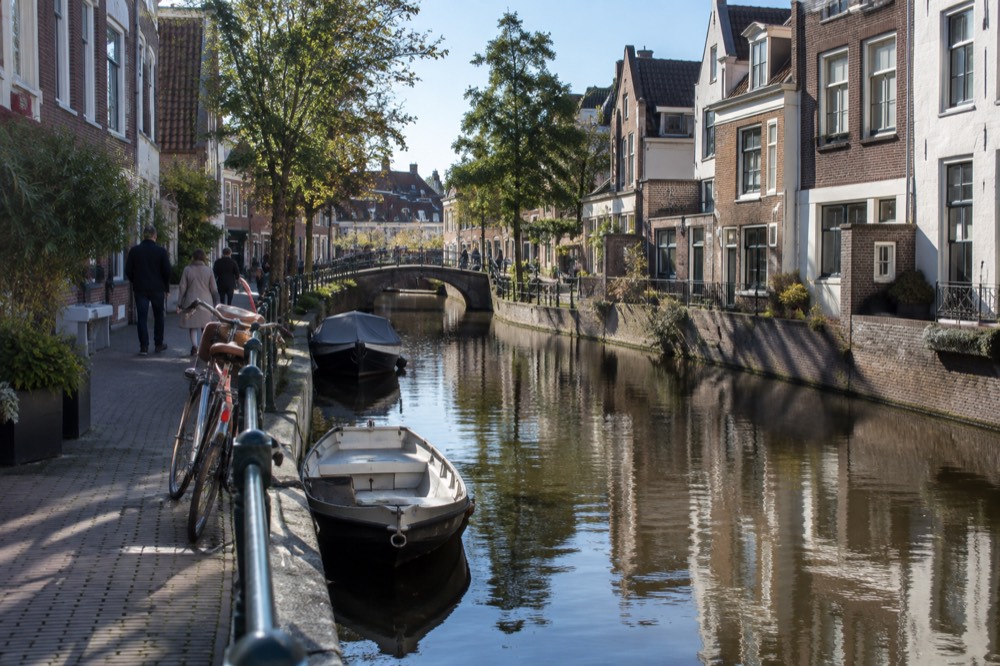 Brick facades and a quiet canal edge beside Gouda