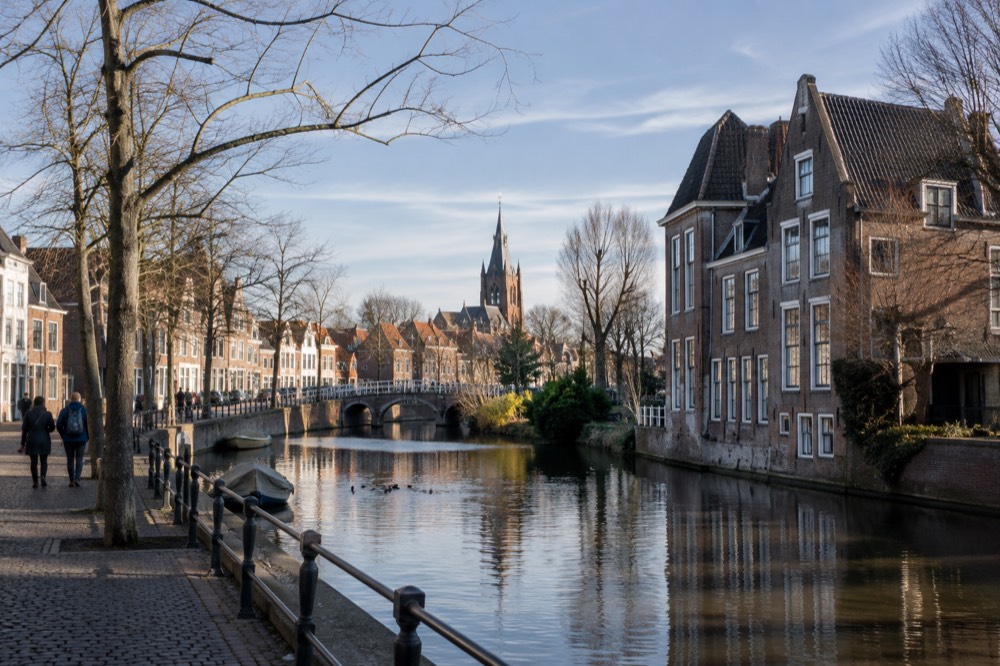 Brick facades and a quiet canal edge beside Gouda