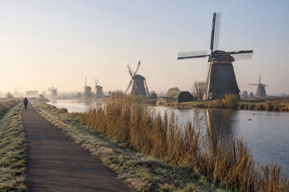 The waterfront near Kinderdijk under a broad grey northern sky