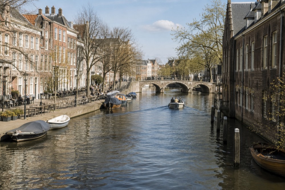 Brick facades and a quiet canal edge beside Leiden