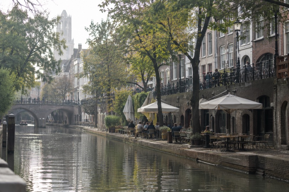Wharf cellars along the Oudegracht canal with restaurant terraces at water level