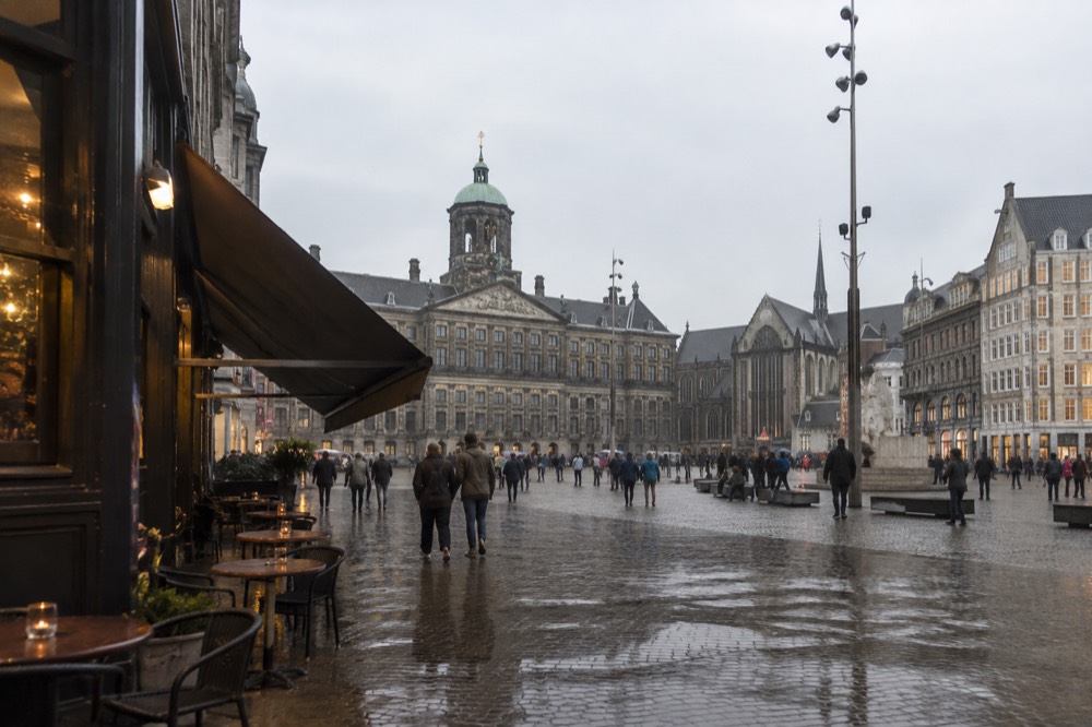 A street-level view of Dam Square on an ordinary weekday morning
