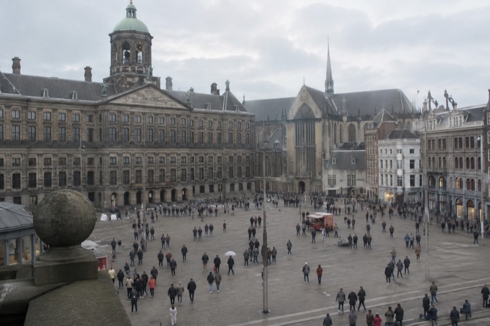 A street-level view of Dam Square on an ordinary weekday morning