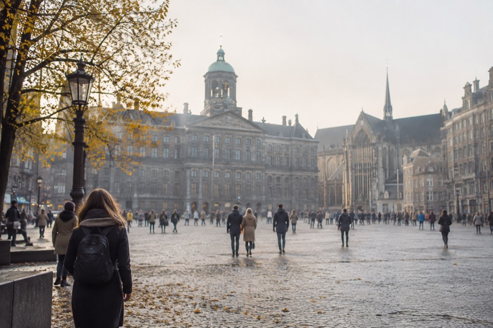 A street-level view of Dam Square on an ordinary weekday morning