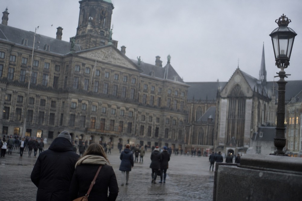 A street-level view of Dam Square on an ordinary weekday morning