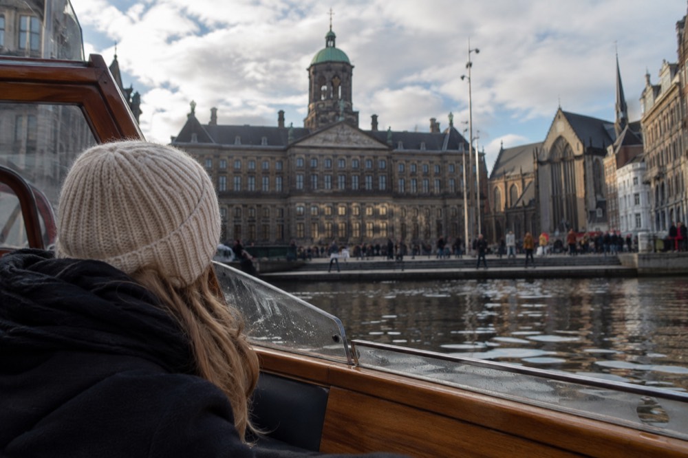 A canal bridge and moored boats close to Dam Square