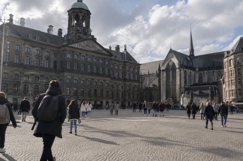 A canal bridge and moored boats close to Dam Square