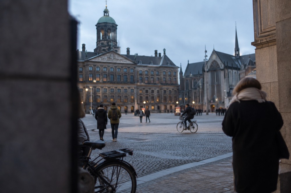A street-level view of Dam Square on an ordinary weekday morning