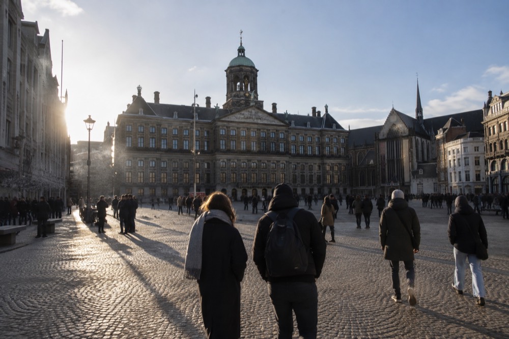 Low winter sun across the rooftops near Dam Square