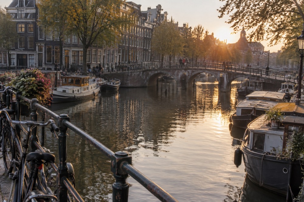 A canal bridge and moored boats close to Dam Square