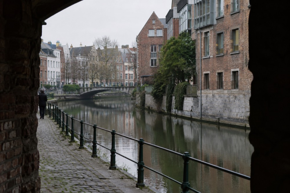 Brick facades and a quiet canal edge beside Brussels