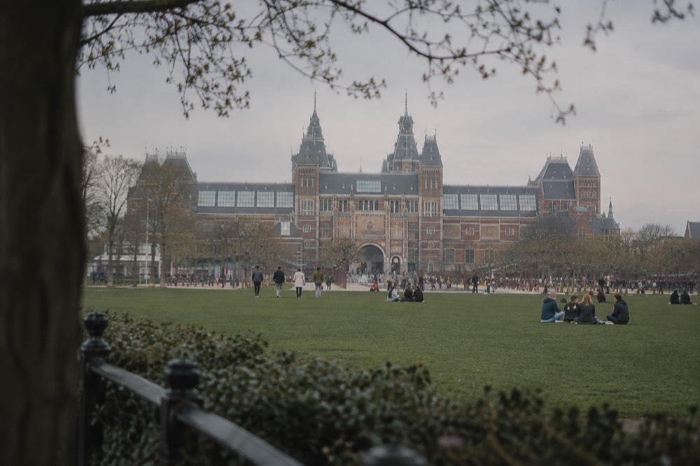 Museumplein in Amsterdam with the Rijksmuseum building behind a lawn