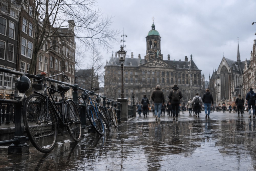 The approach to Dam Square, with bicycles leaning against the railings