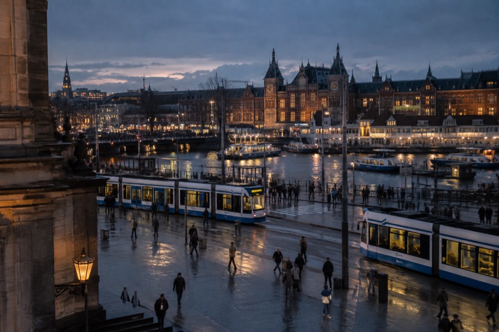 Amsterdam trams passing outside the central station forecourt