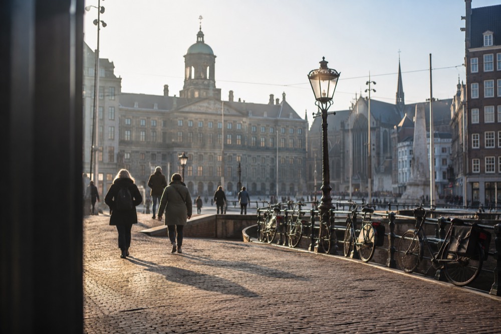 The approach to Dam Square, with bicycles leaning against the railings