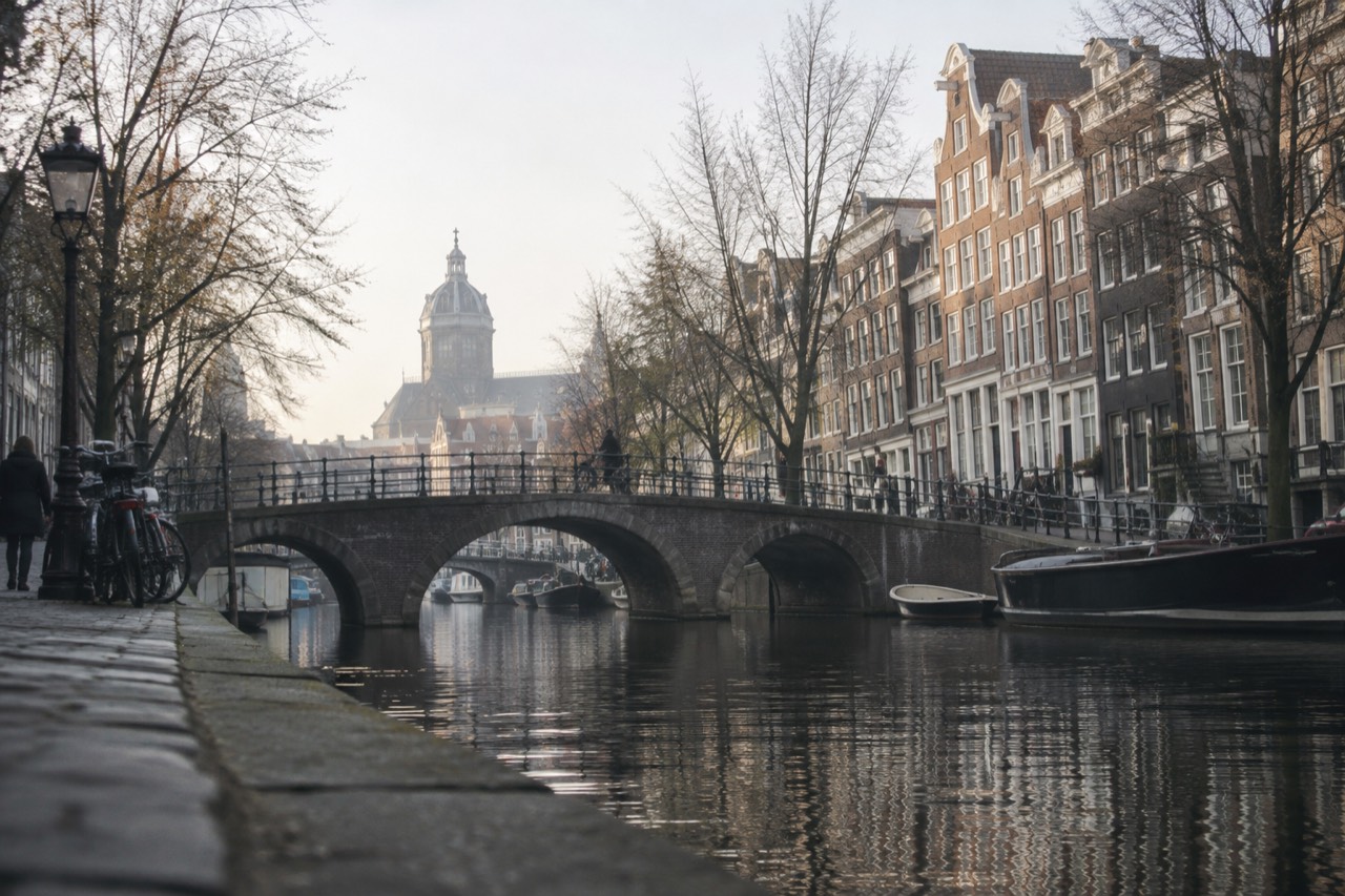 Canal houses and a bridge over an Amsterdam canal in morning light