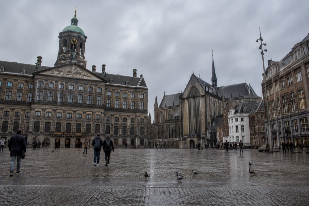 A street-level view of Dam Square on an ordinary weekday morning